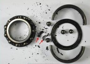 A broken bearing from an industrial machine.